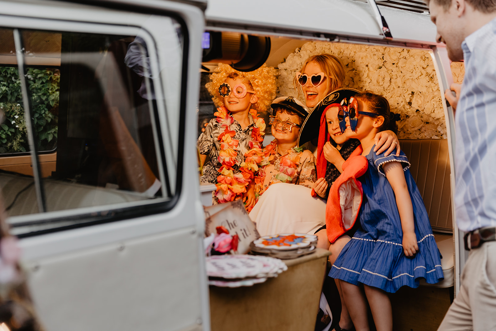 Bride with kids in VW Photo Boot at a Bury Manor Barn Wedding in Sussex. Photographer OliveJoy Photography.