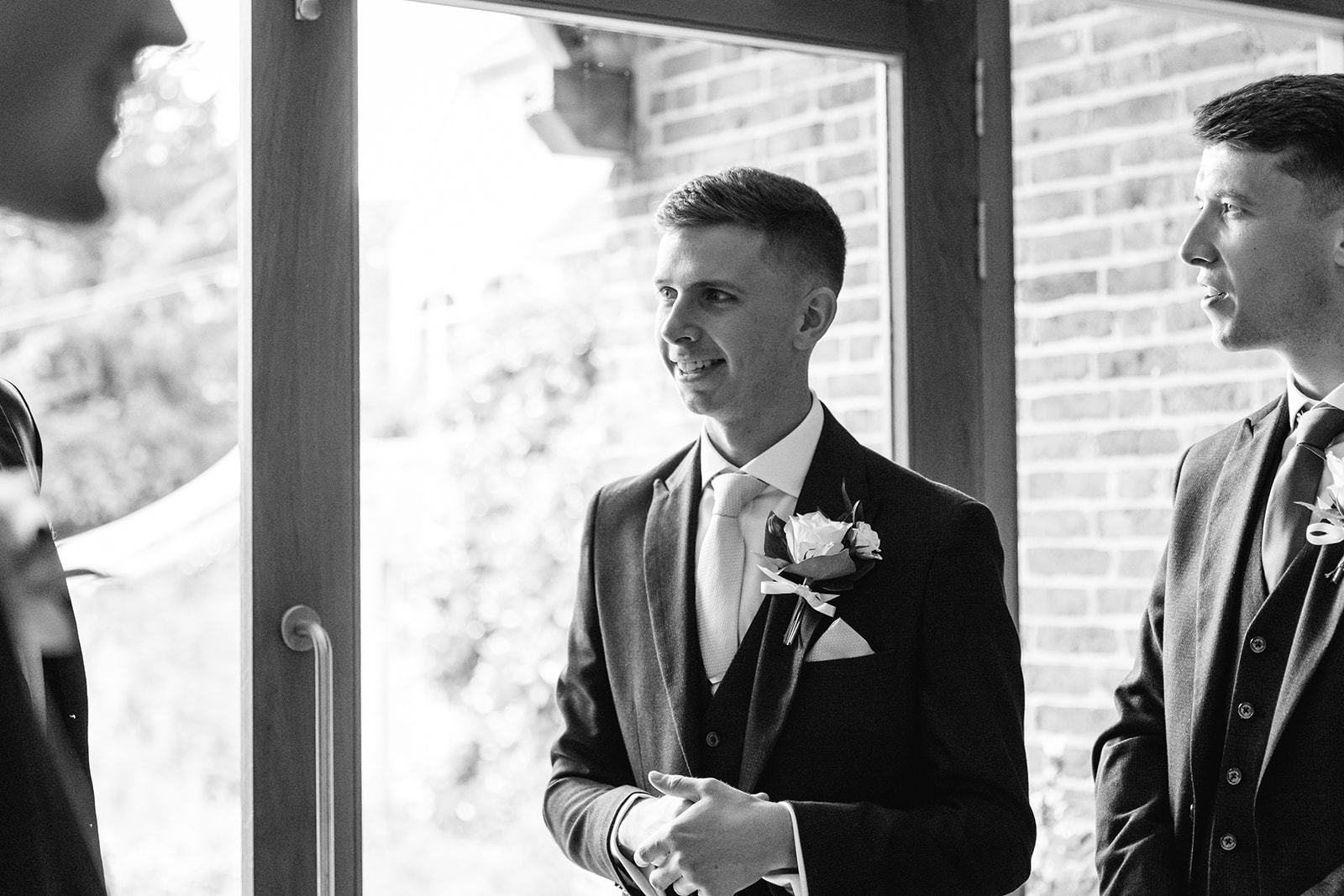 Groom awaiting bride at a Bury Manor Barn Wedding in Sussex. Photographer OliveJoy Photography.