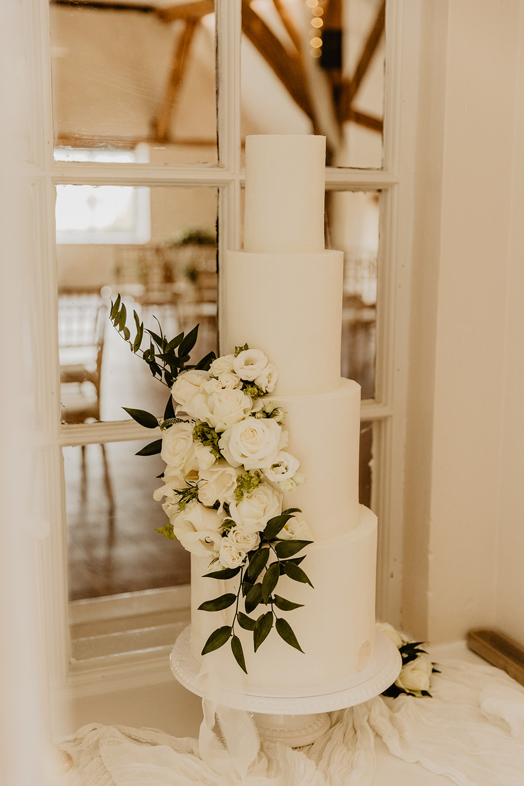 Wedding cake at a Bury Manor Barn Wedding in Sussex. Photographer OliveJoy Photography.
