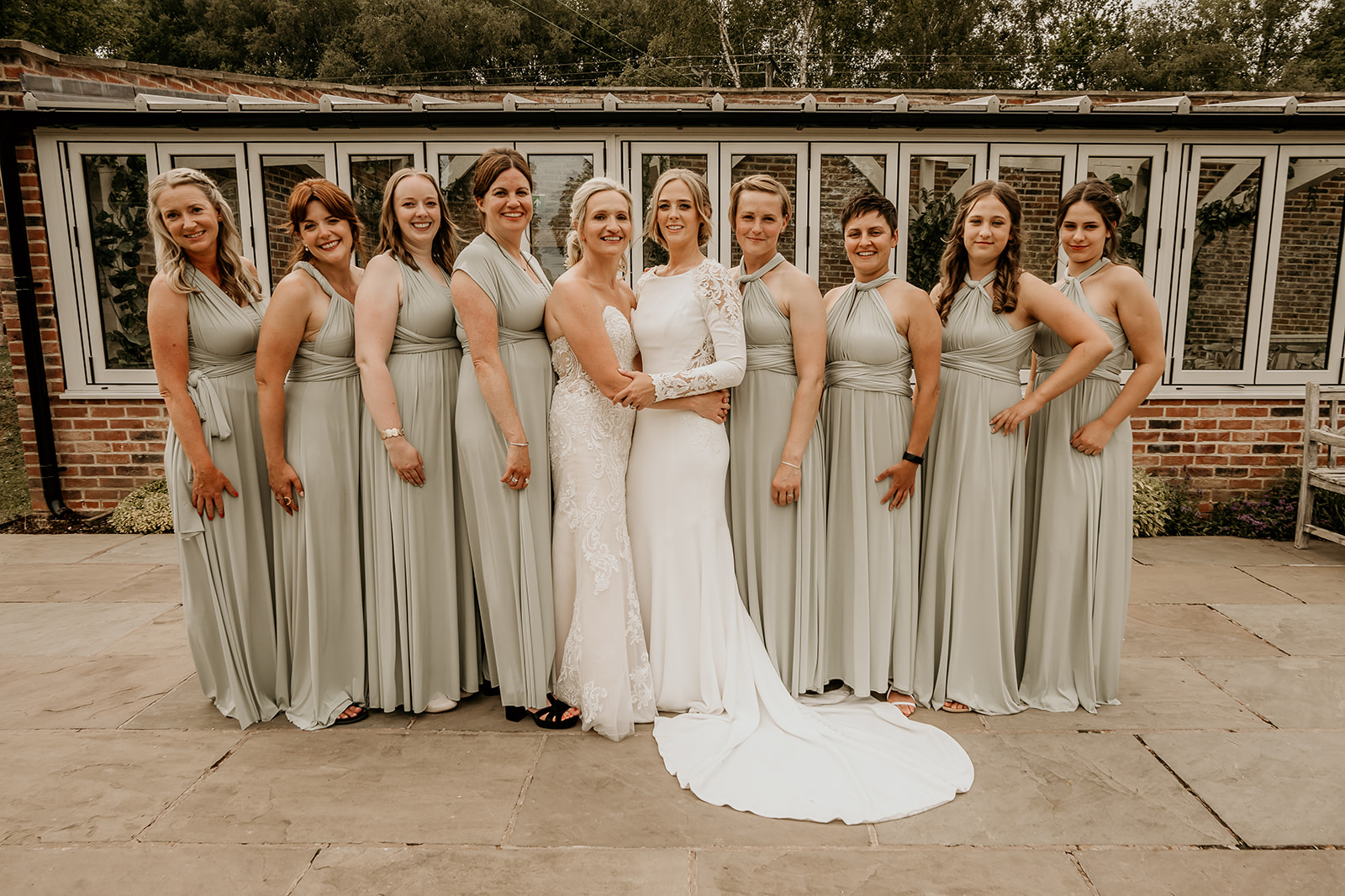 brides and bridesmaids at foxtails barn wedding venue