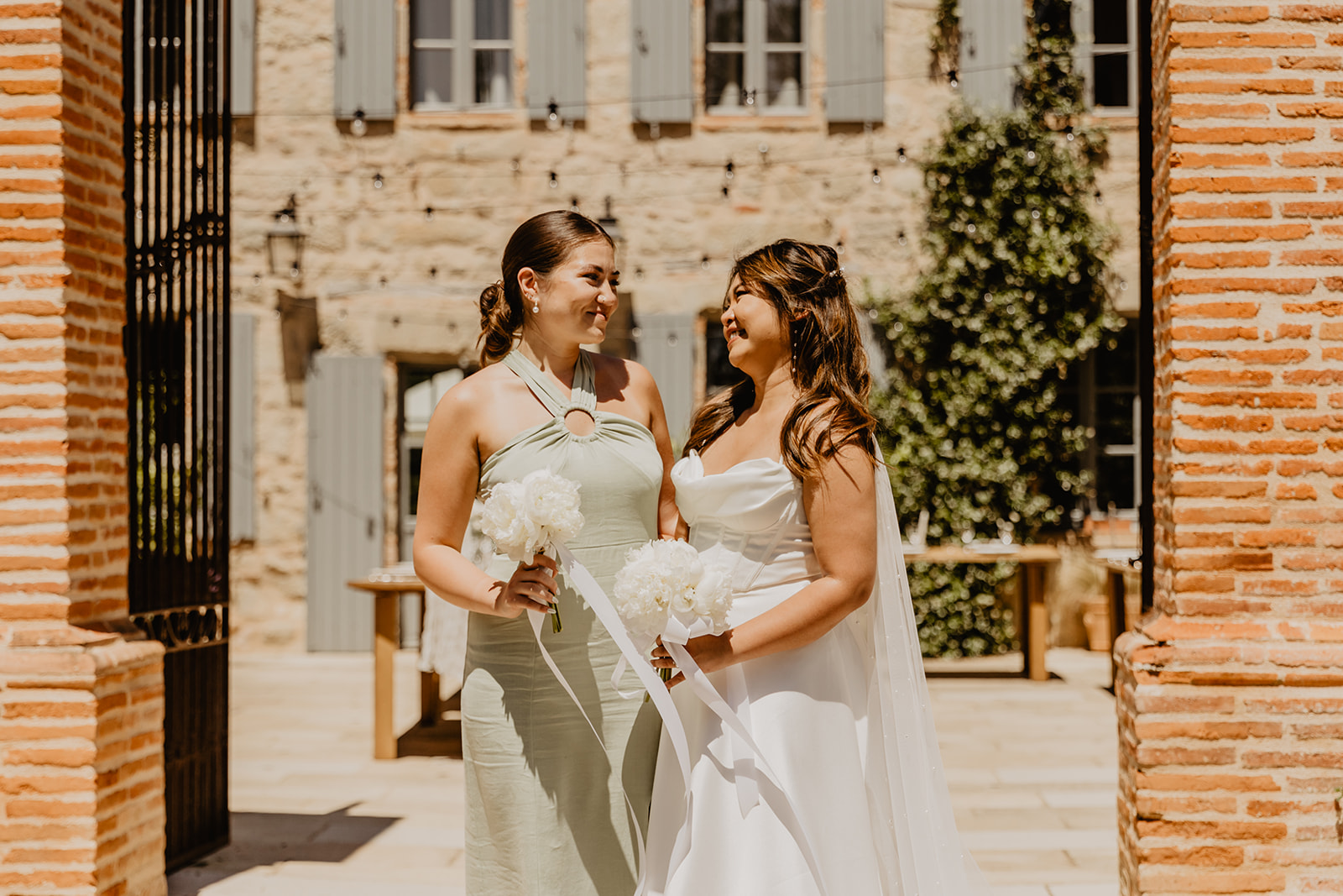 Bride and bridesmaid at a France Destination Wedding. Photography and Videography by Olive Joy Photography