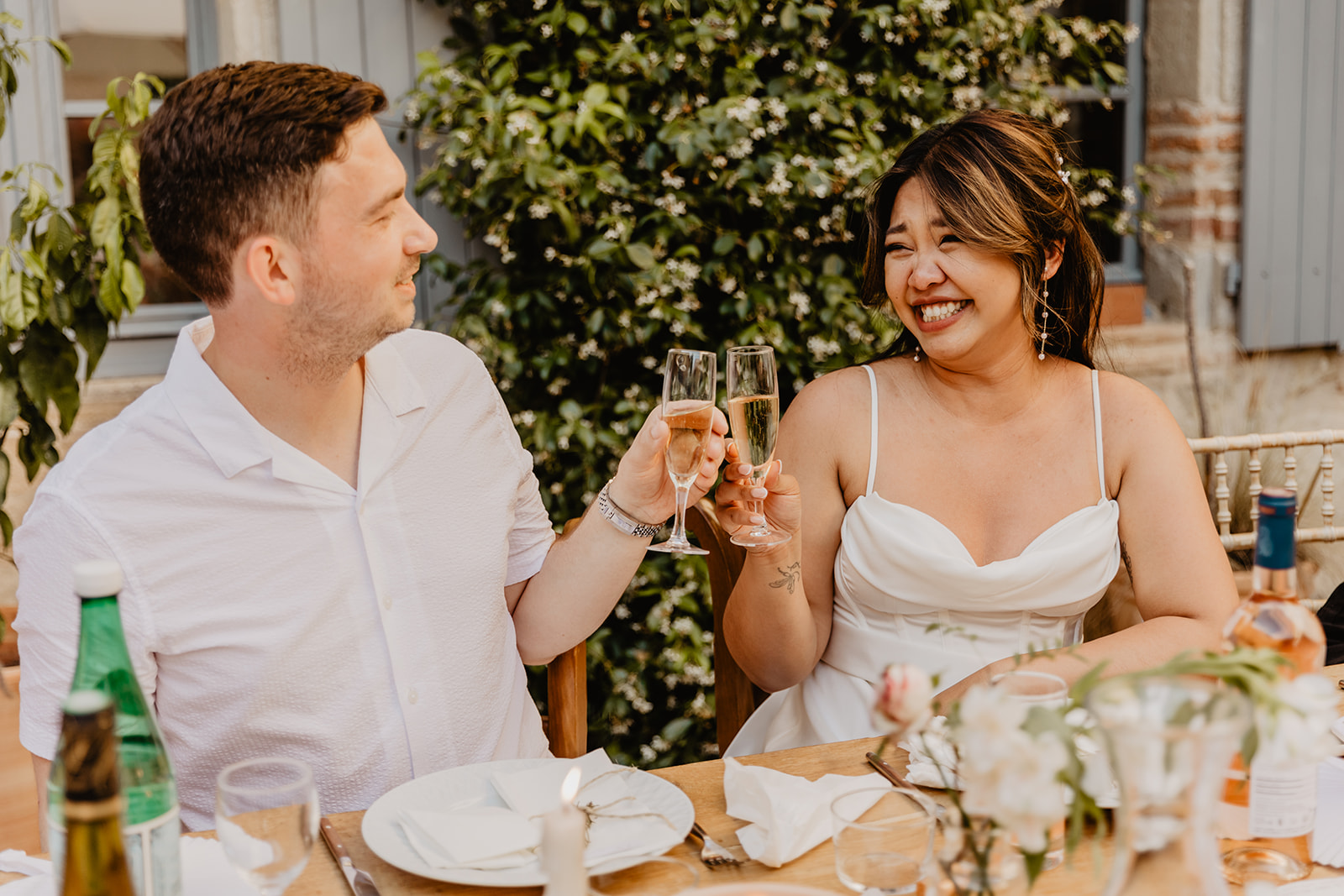 Bride and groom toasting at a France Destination Wedding. Photography and Videography by Olive Joy Photography