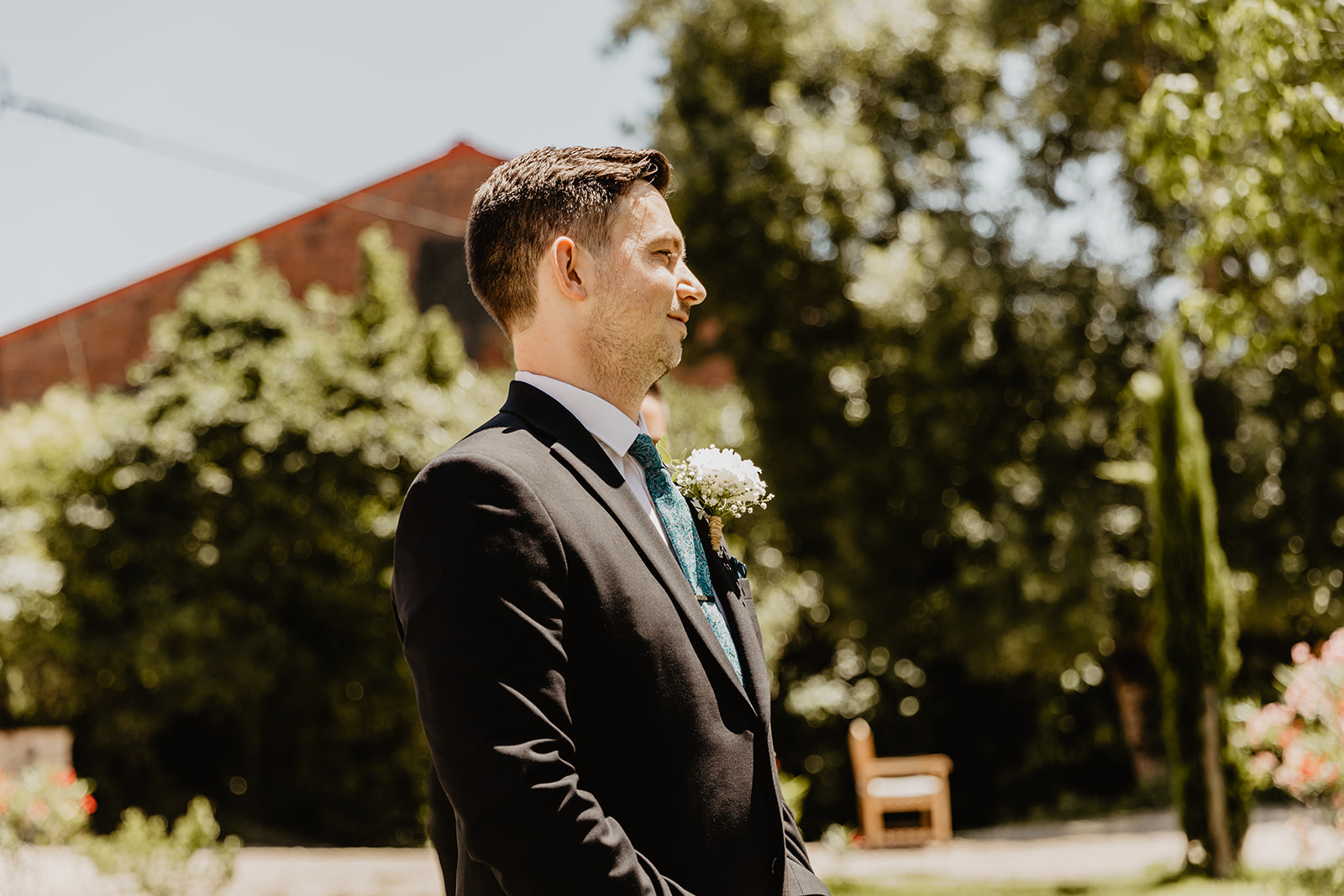 Groom at the top of the aisle at a France Destination Wedding. Photography and Videography by Olive Joy Photography