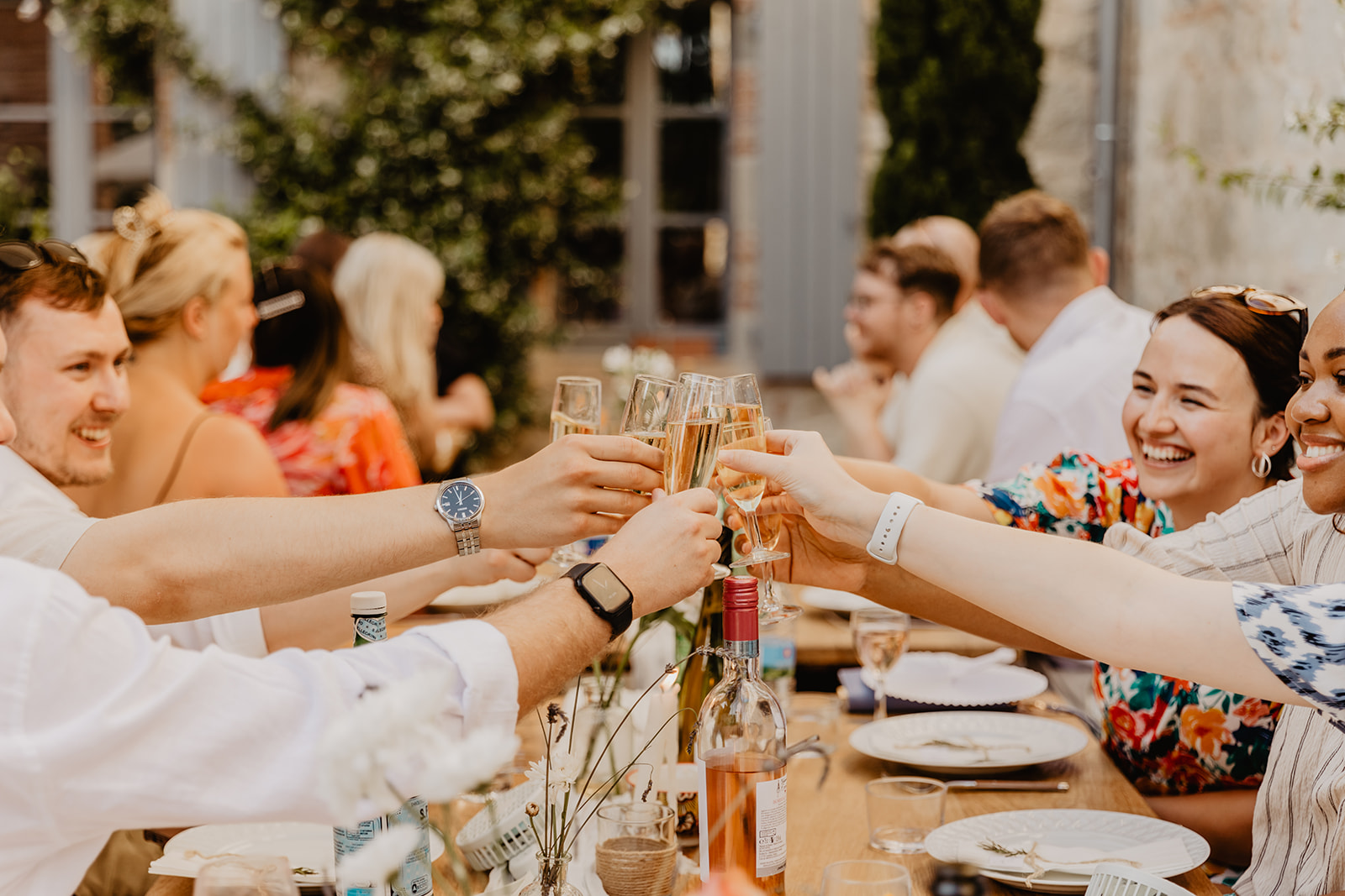 Guests toasting at reception at a France Destination Wedding. Photography and Videography by Olive Joy Photography