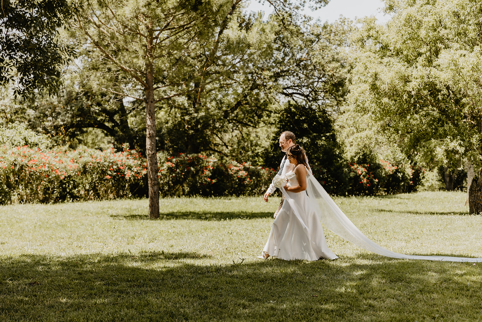 Bride and father walking at a Destination Wedding in France. Photography & Videography by OliveJoy Photography