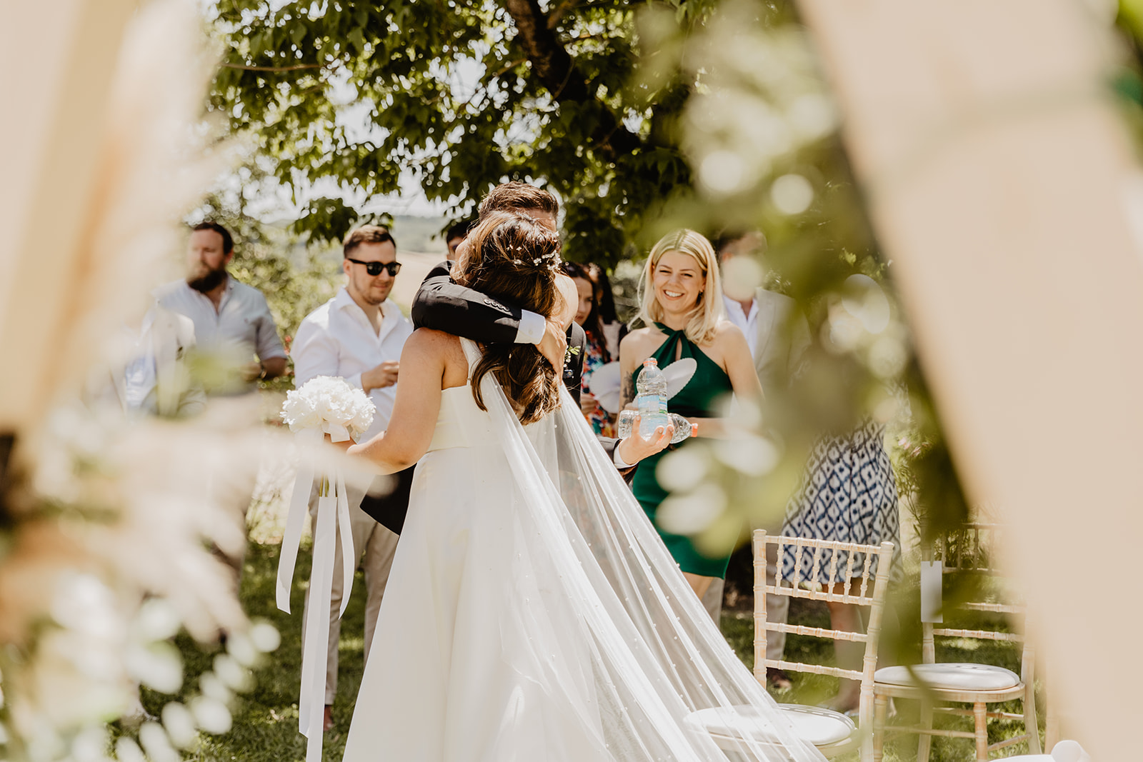 Bride hugging at a Destination Wedding in France. Photography & Videography by OliveJoy Photography