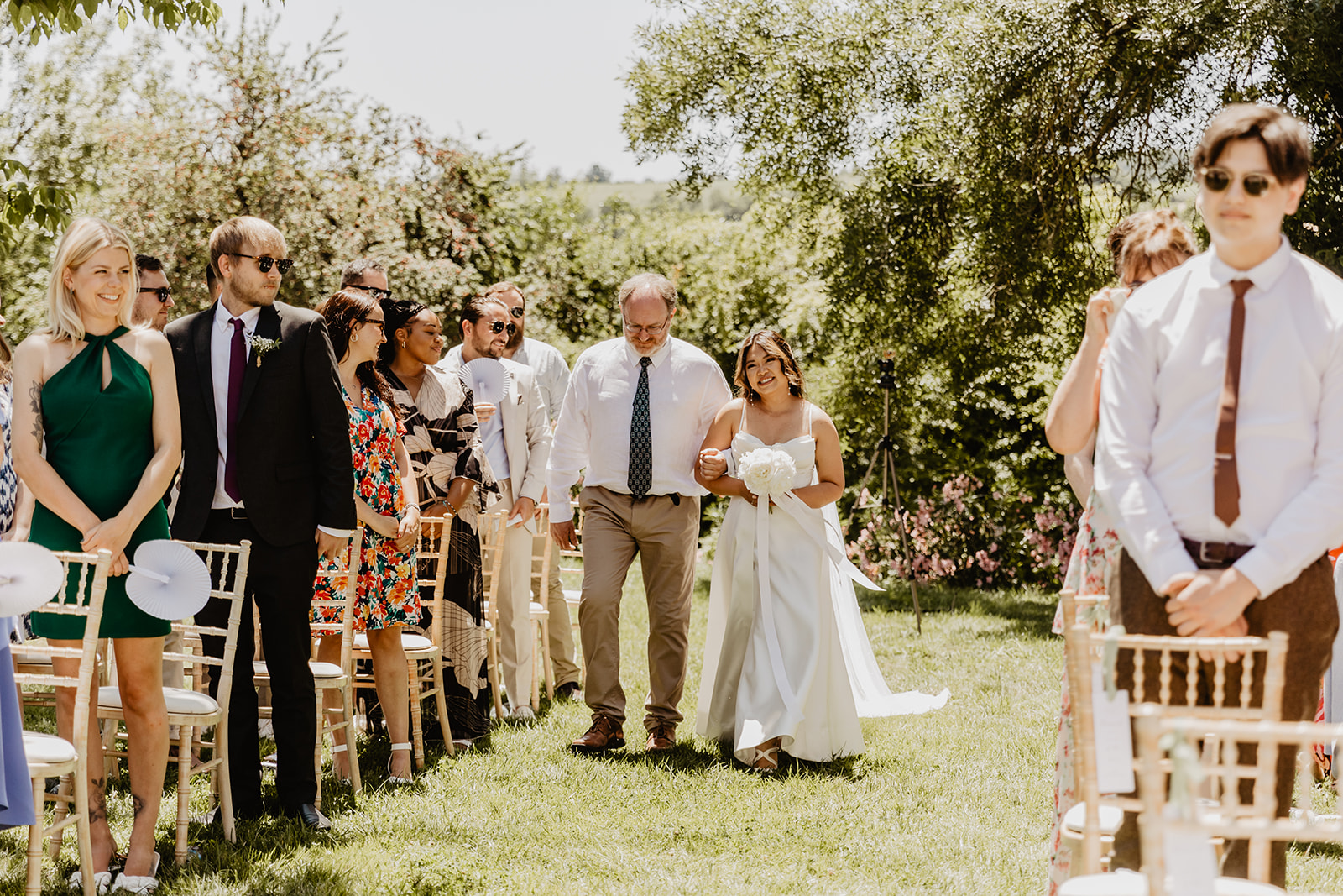 Father and bride down aisle at a Destination Wedding in France. Photography & Videography by OliveJoy Photography