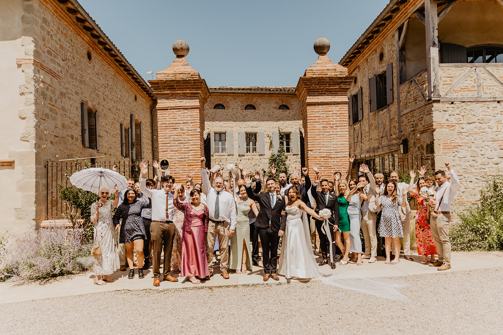 Wedding guests group photo at a Destination Wedding in France. Photography & Videography by OliveJoy Photography