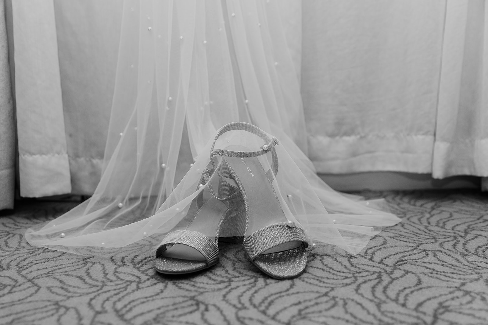 bridal shoes on top veil