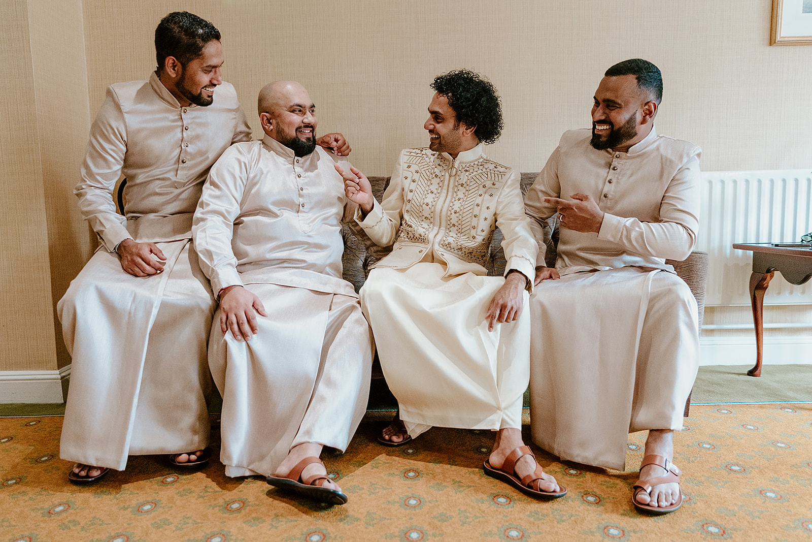 groom getting ready for Sri Lankan wedding with groomsmen