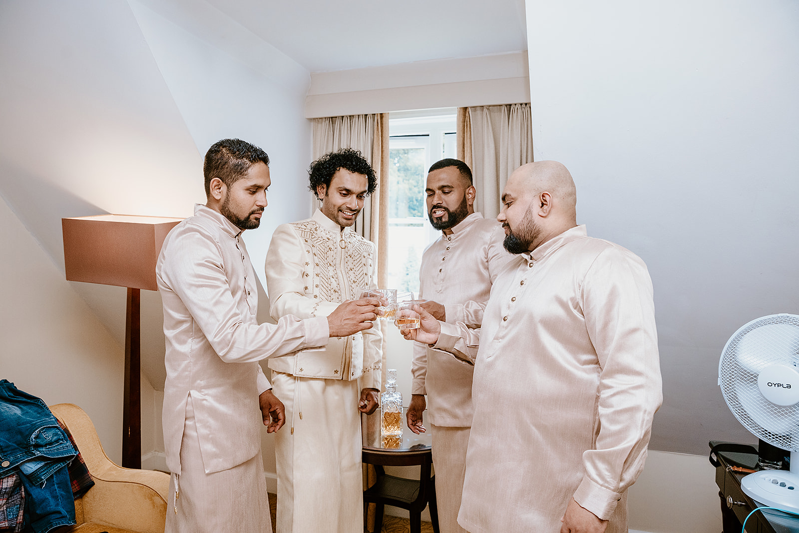 groom getting ready for Sri Lankan wedding with groomsmen