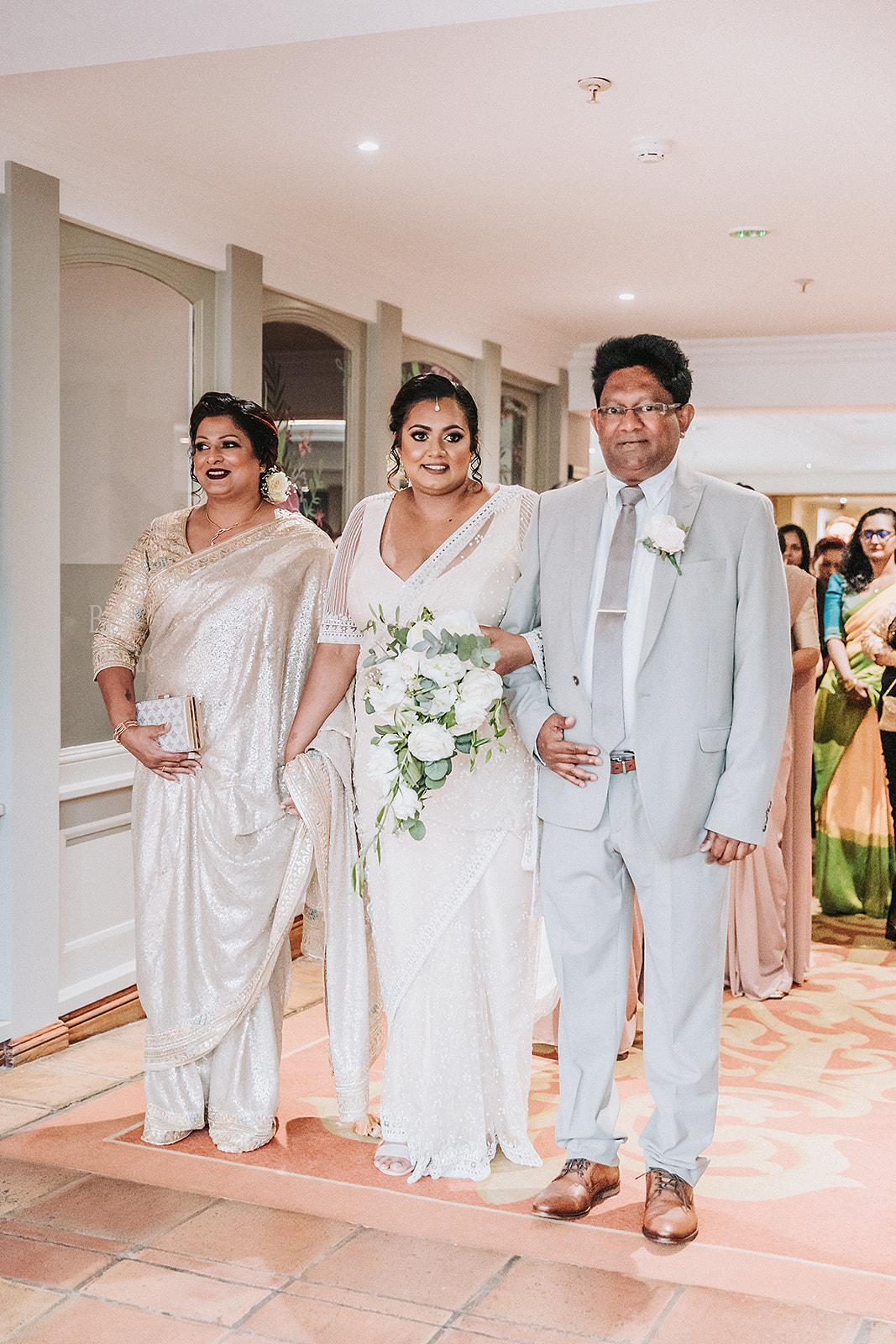 the bride and her parents arriving at the Sri Lankan wedding