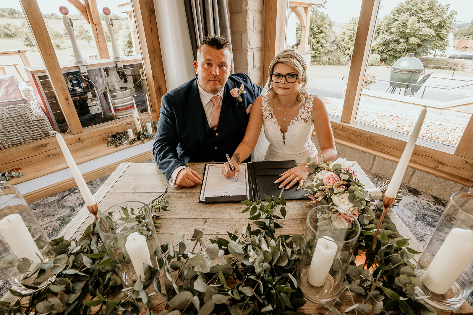 Signing register during wedding day