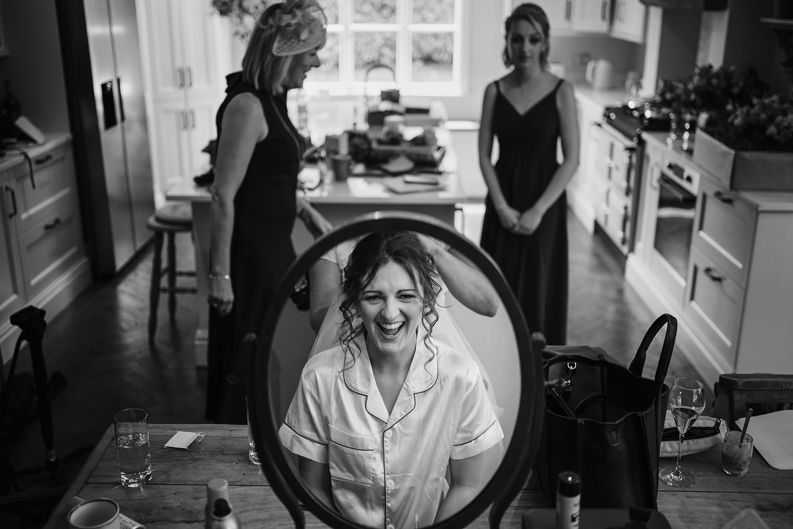 Bride laughing during preparations 