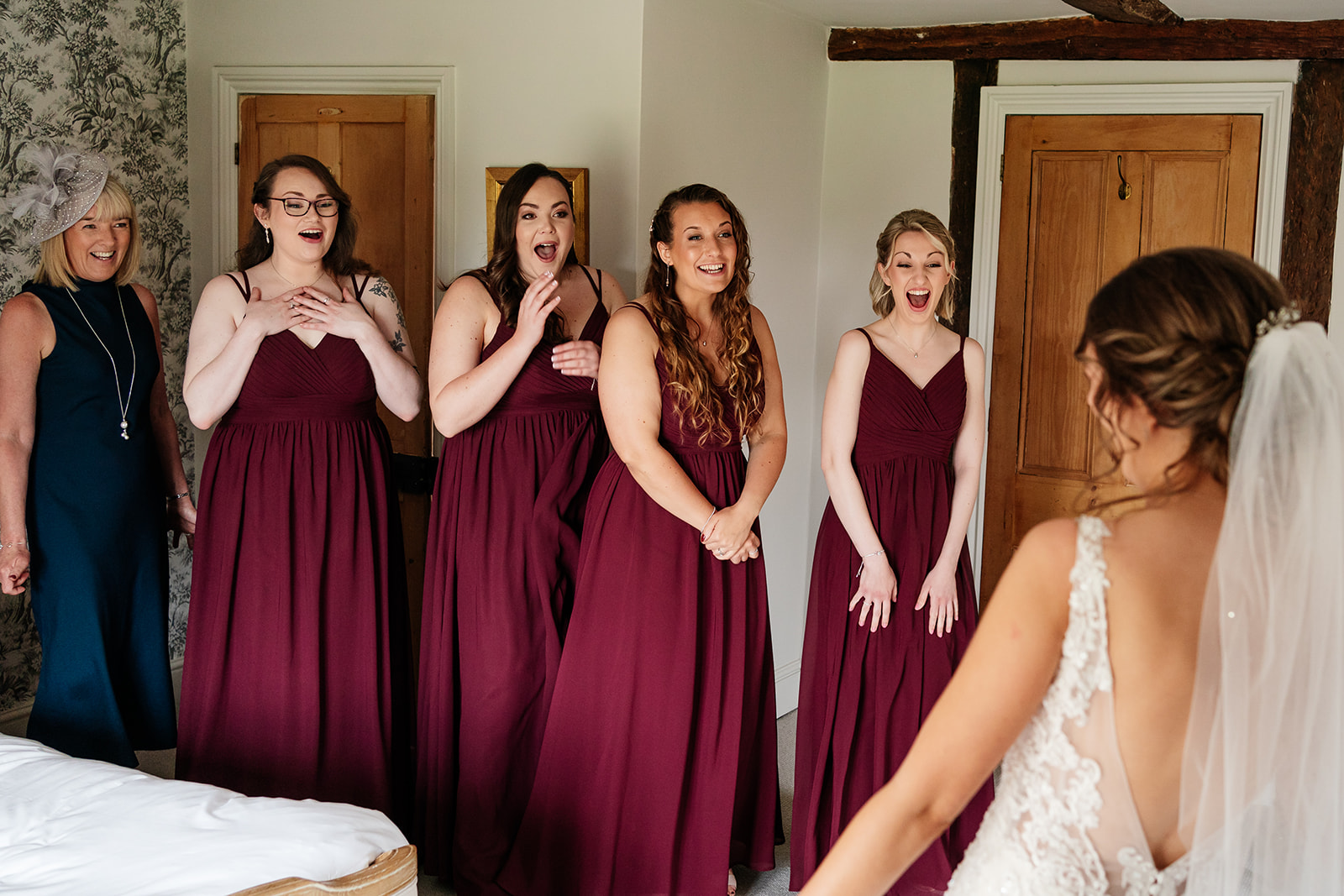 Bridesmaids seeing bride for the first time and reacting 