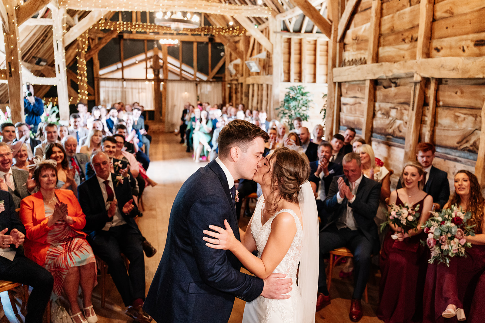 Bride and grooms first kissing during ceremony at Silcester Farm 
