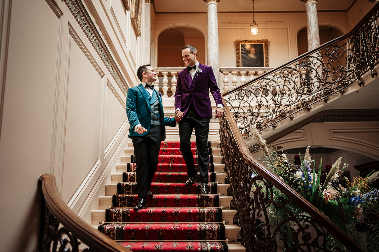 Couple walk down stairs at Mount Ephraim Country House & Gardens
