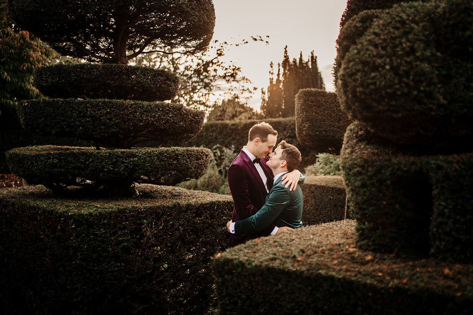 Same Sex couple in topiary garden at Mount Ephraim Country House & Gardens