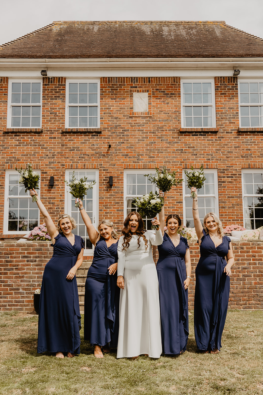 Bride and bridesmaids at a Field Place Manor House Wedding in Worthing, Sussex. By Olive Joy Photography