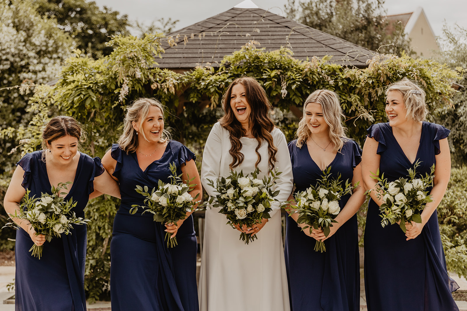 Bride and bridesmaids at a Field Place Manor House Wedding in Worthing, Sussex. By Olive Joy Photography