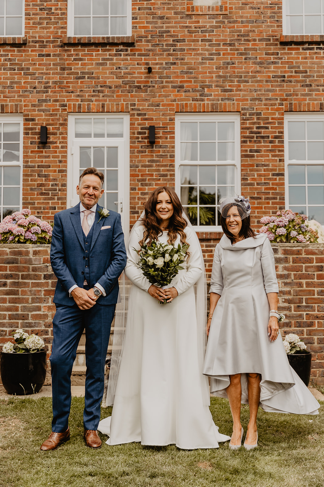 Bride and her parents at a Field Place Manor House Wedding in Worthing, Sussex. By Olive Joy Photography
