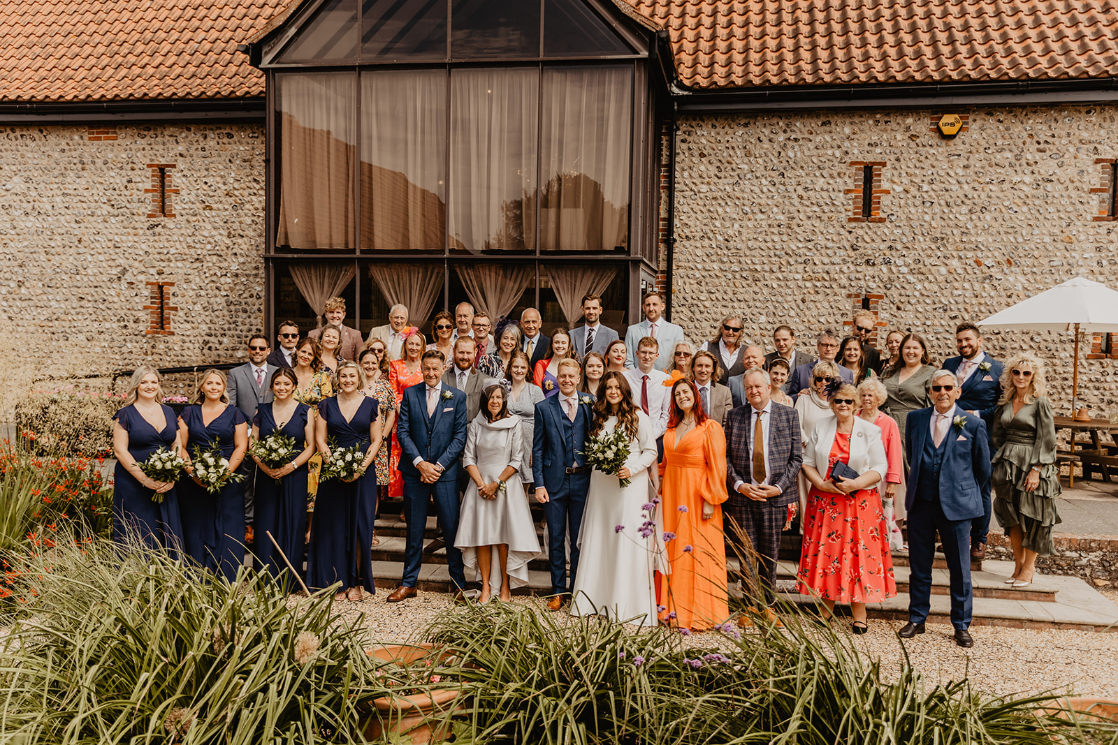 Wedding group photo at a Field Place Manor House Wedding in Worthing, Sussex. By Olive Joy Photography