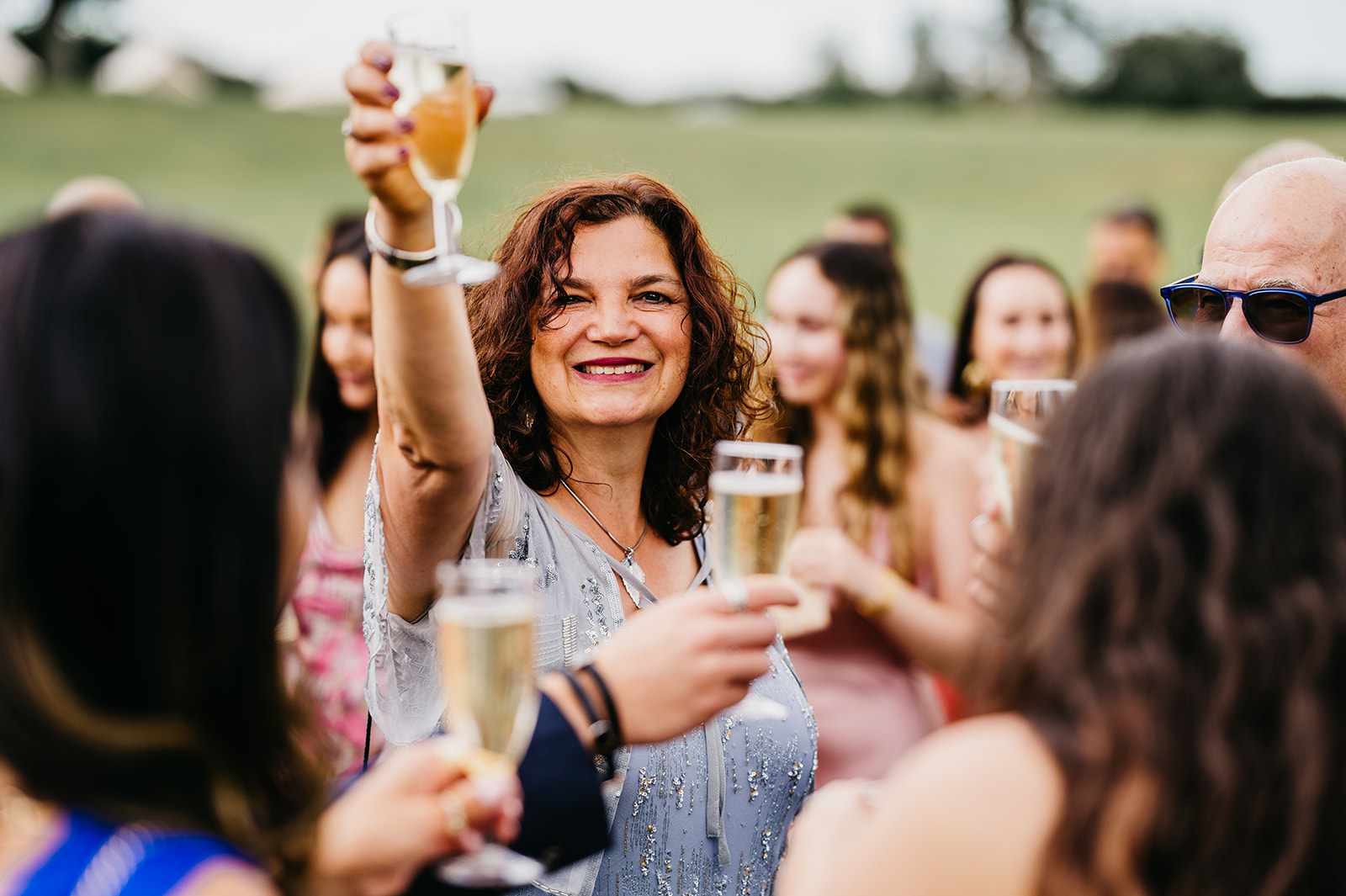 wedding guest celebrates with champagne