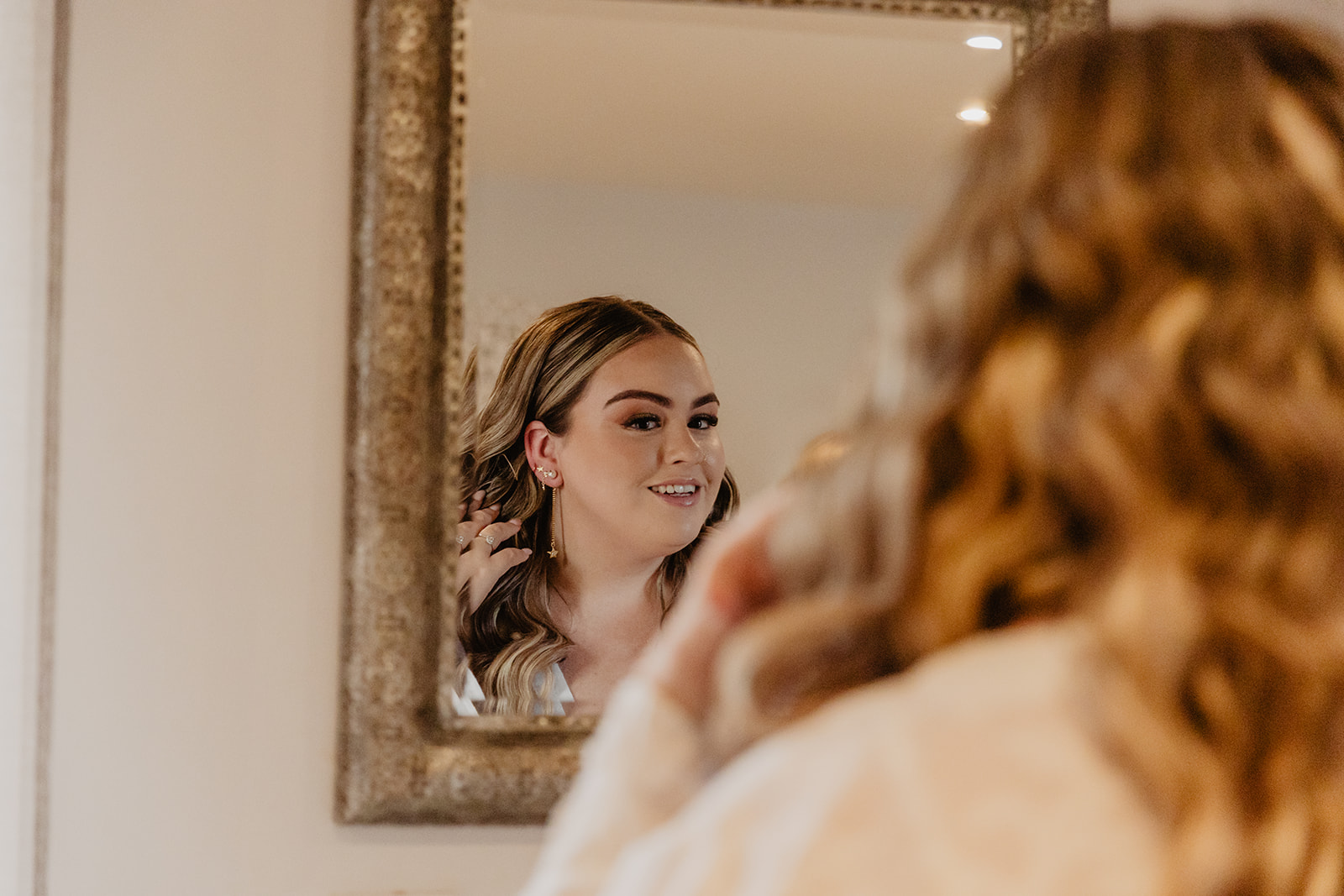 Bride getting ready at a Long Furlong Barn Wedding in Worthing, Sussex. By Olive Joy Photography.