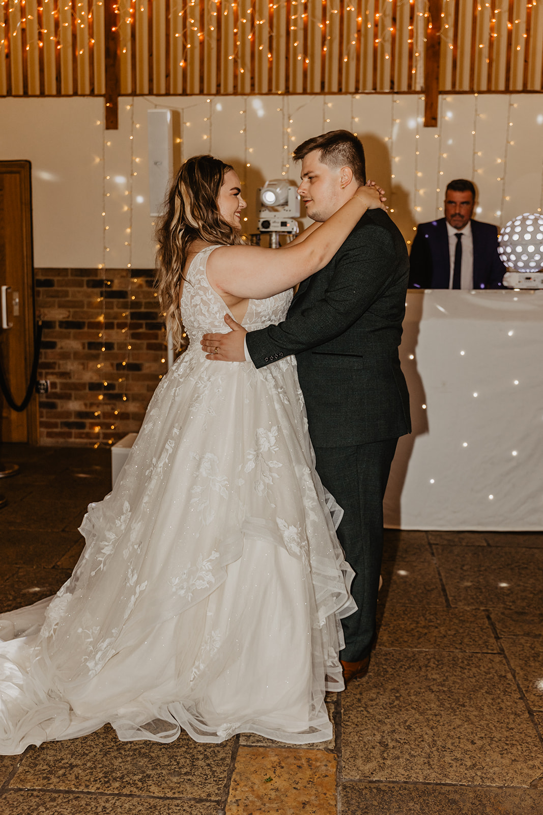 Bride and Groom have first dance at a Long Furlong Barn Wedding in Worthing, Sussex. By Olive Joy Photography.