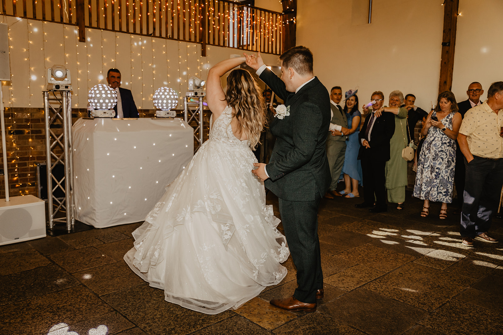Bride and Groom have first dance at a Long Furlong Barn Wedding in Worthing, Sussex. By Olive Joy Photography.