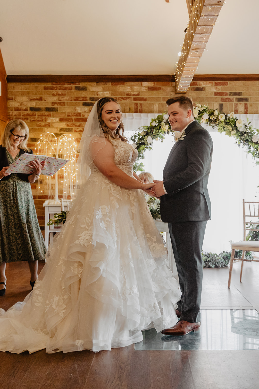 Bride and groom at a Long Furlong Barn Wedding in Worthing, Sussex. By Olive Joy Photography.