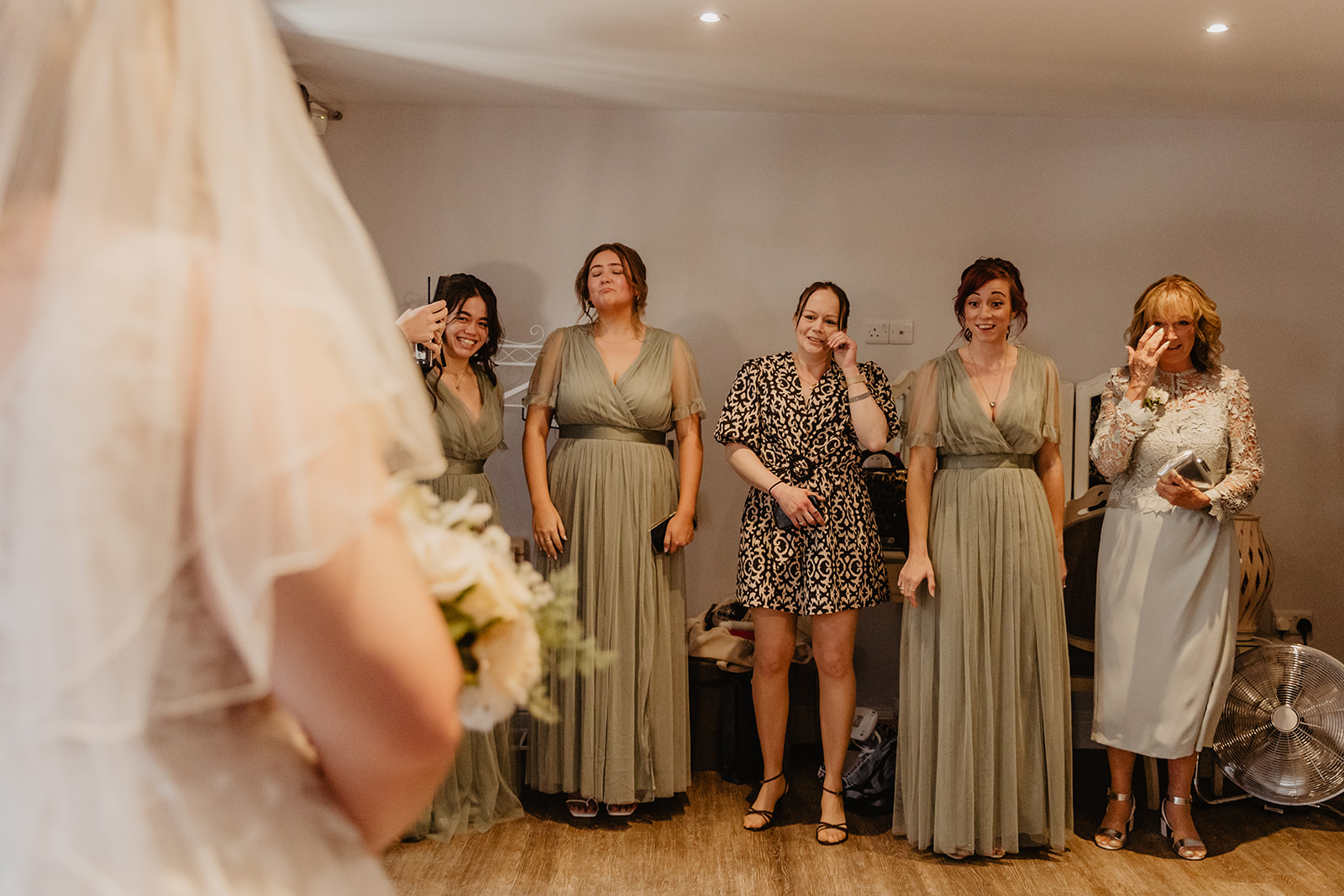 Bride and her bridesmaids' first look at a Long Furlong Barn Wedding in Worthing, Sussex. By Olive Joy Photography.