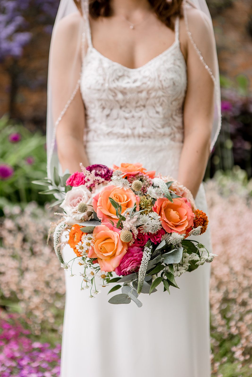 Bridal bouquet with orange and pink flowers