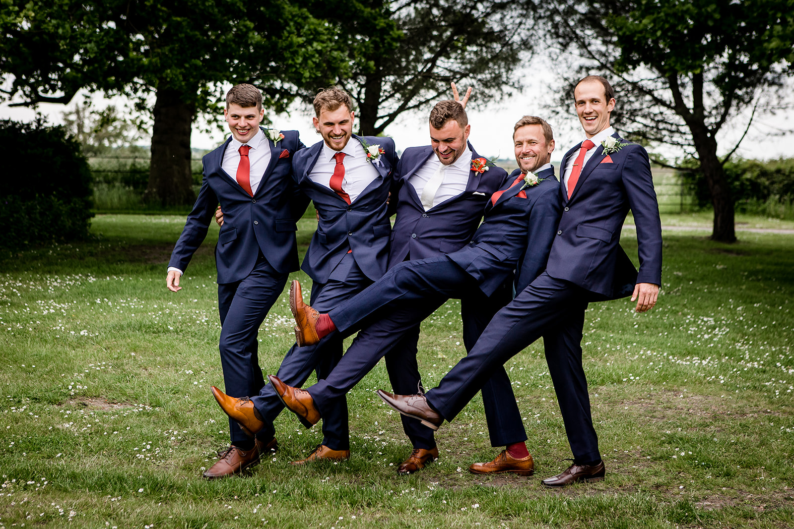 Groomsmen and groom being silly