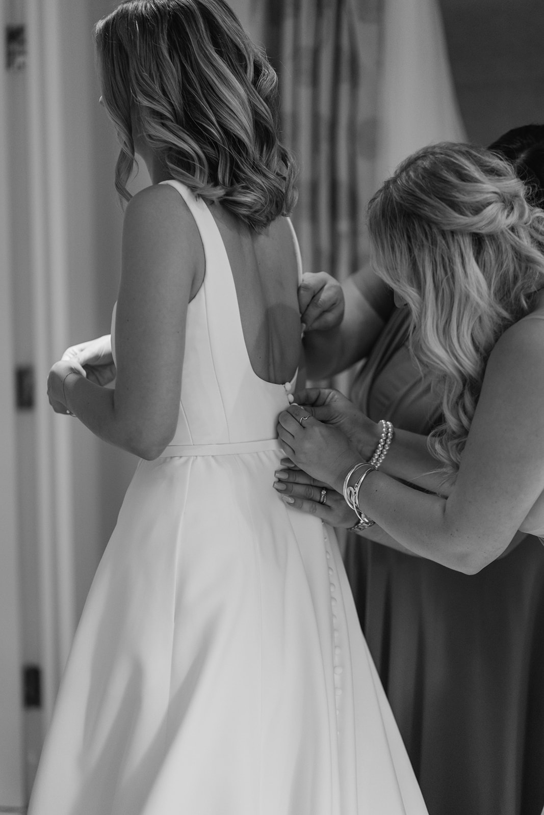 Bride getting ready at a Great Tythe Barn Wedding, Cotswolds. By Olive Joy Photography.