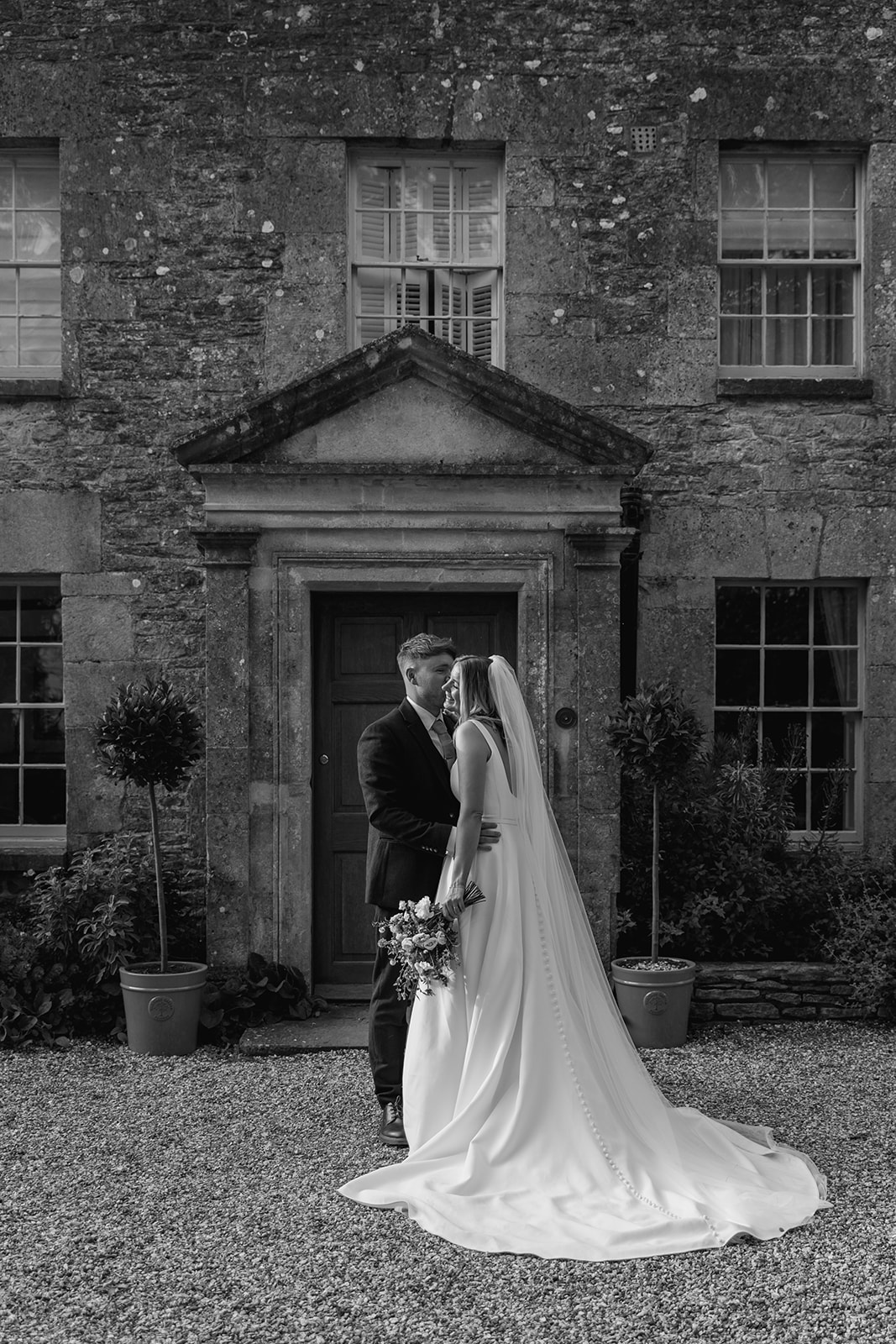 Bride and Groom at a Great Tythe Barn Wedding, Cotswolds. By Olive Joy Photography.