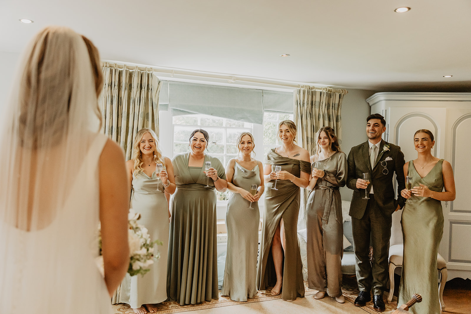 First look for the bridesmaids at a Great Tythe Barn Wedding, Cotswolds. By Olive Joy Photography.