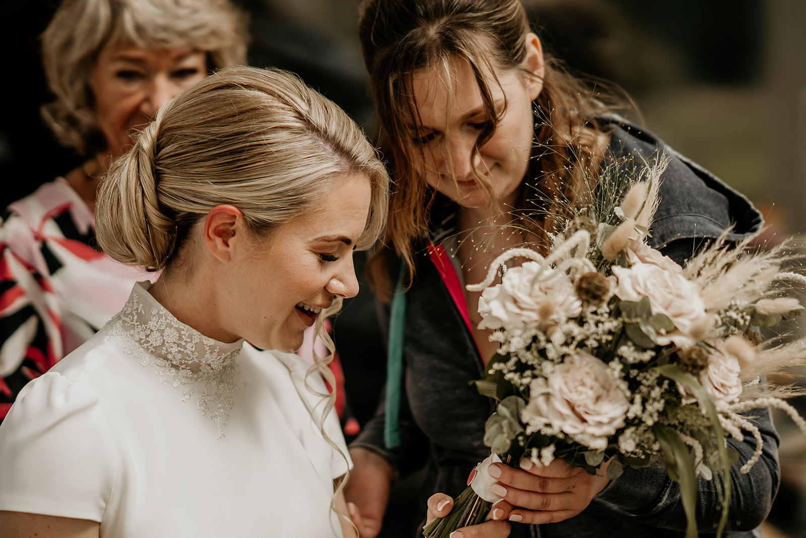 bride looking at wedding flowers