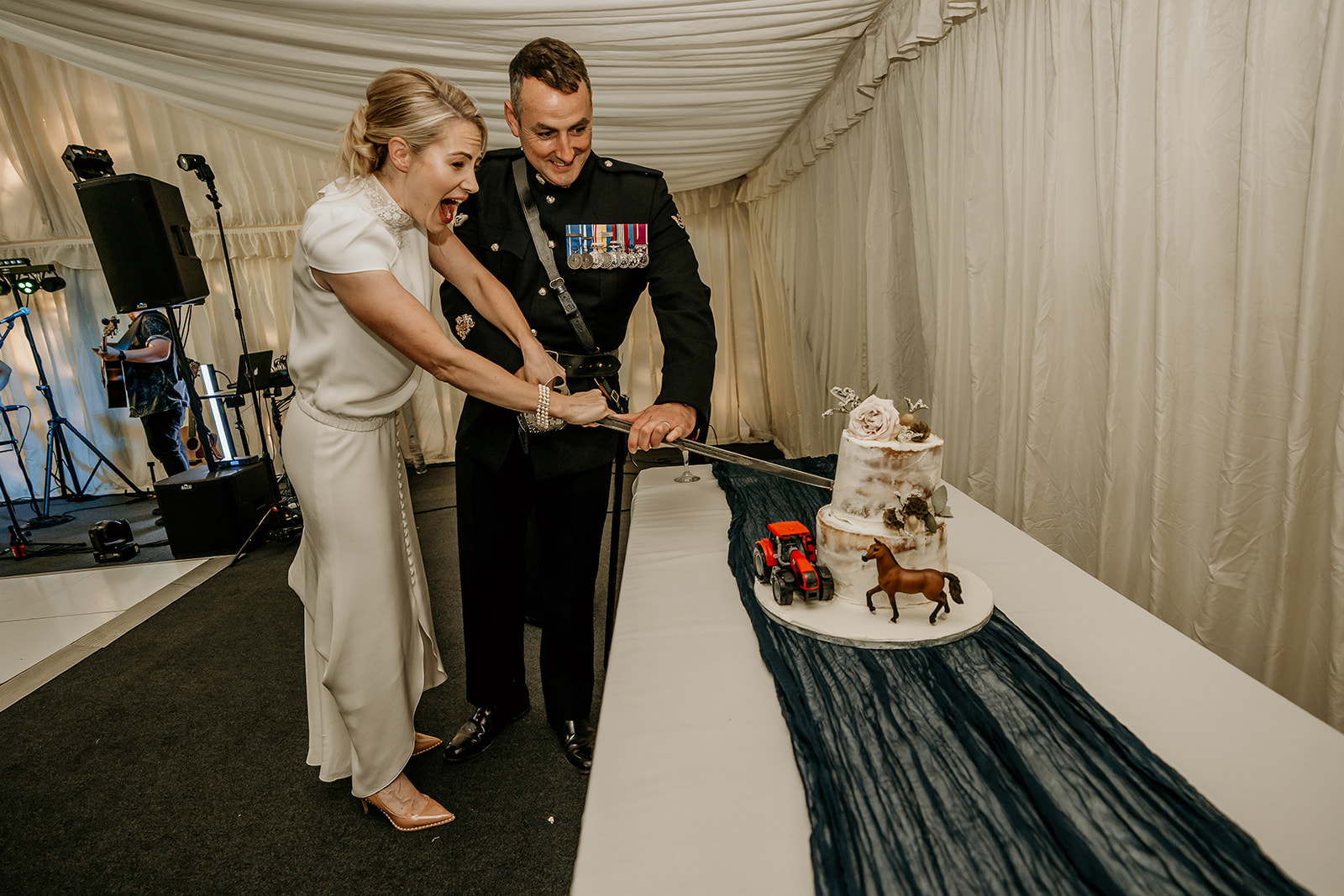 cutting the cake with ceremonial sword