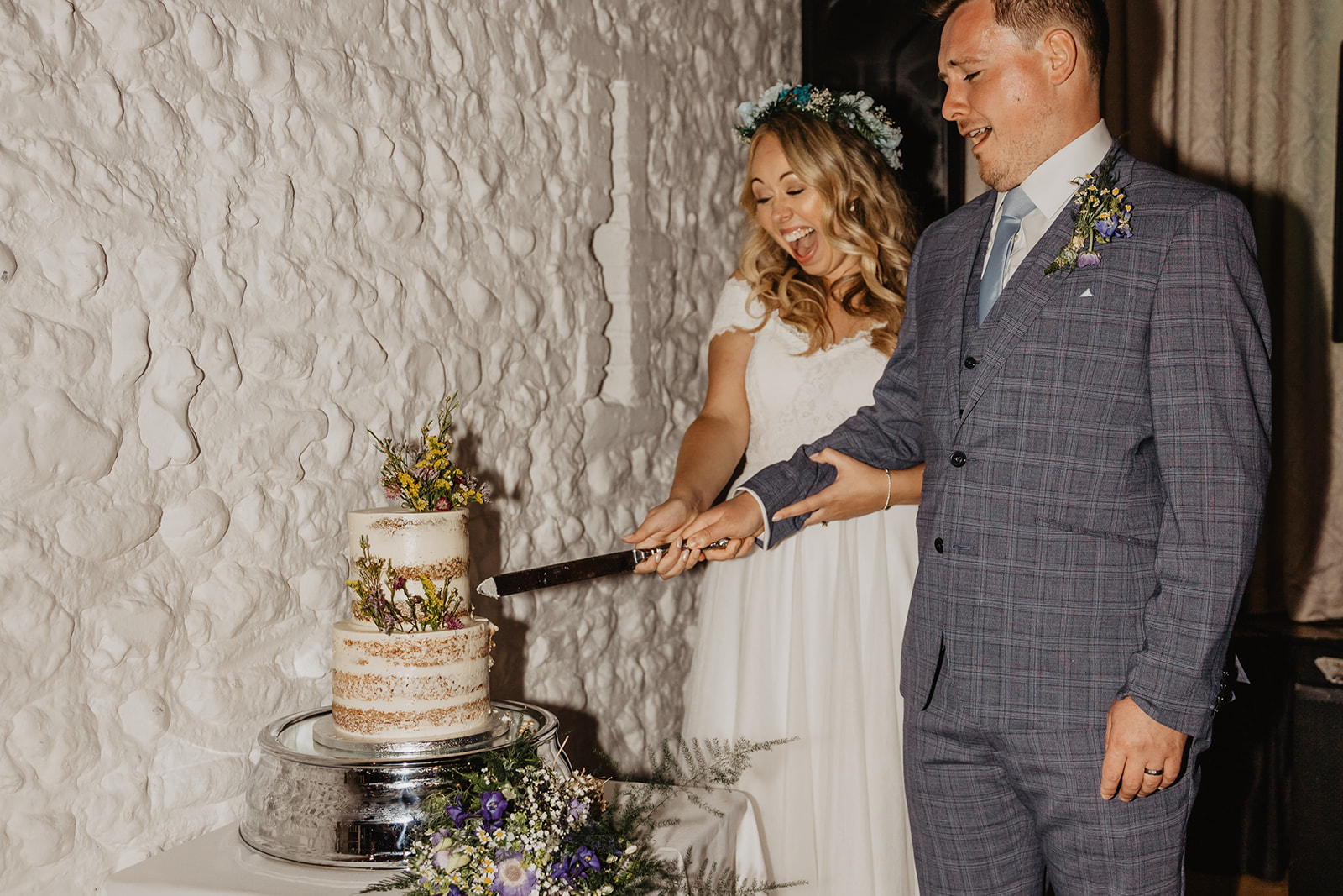 Bride and groom cutting their cake at Field Place Wedding Worthing, Sussex. By OliveJoy Photography.