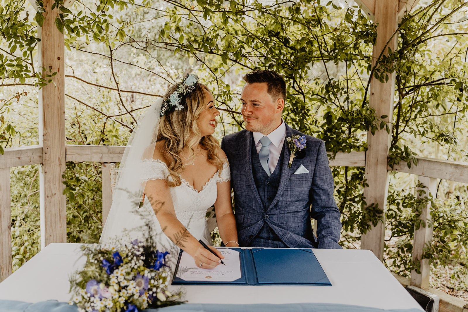 Bride and Groom signing the register at Field Place Wedding Worthing, Sussex. By OliveJoy Photography.