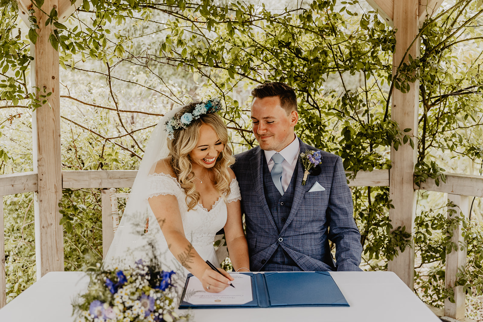 Bride and Groom signing the register at Field Place Wedding Worthing, Sussex. By OliveJoy Photography.
