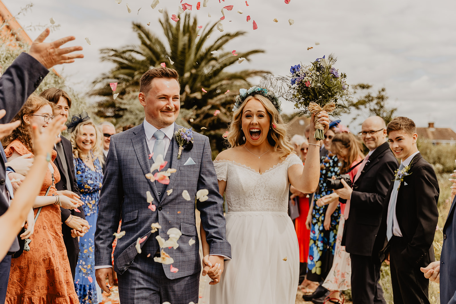 Bride and groom under confetti at Field Place Wedding Worthing, Sussex. By OliveJoy Photography.