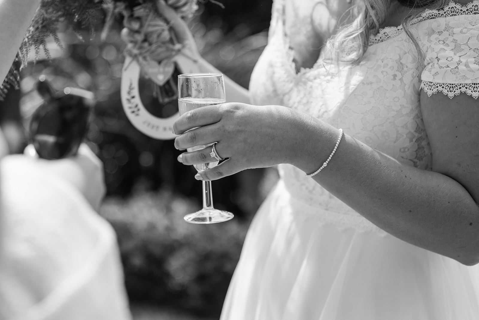Bride holding wine at Field Place Wedding Worthing, Sussex. By OliveJoy Photography.