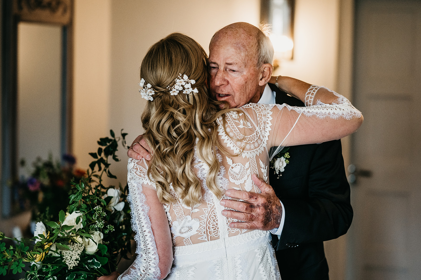 father of the bride hugs daughter