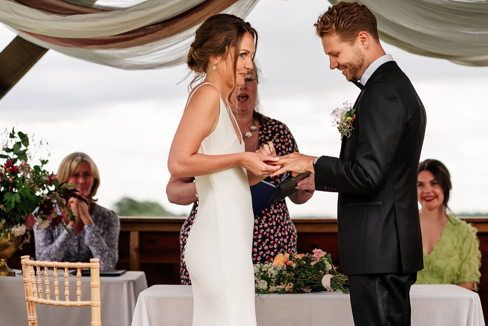 Ring exchange during outdoor ceremony at hunts mill farm 