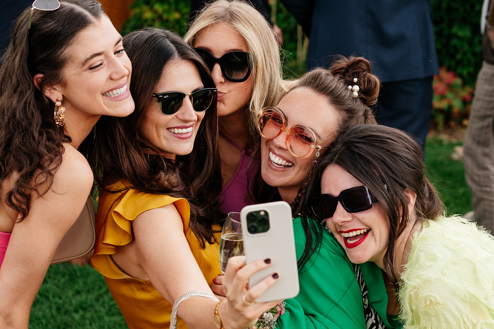 Group of guests taking selfie at wedding 