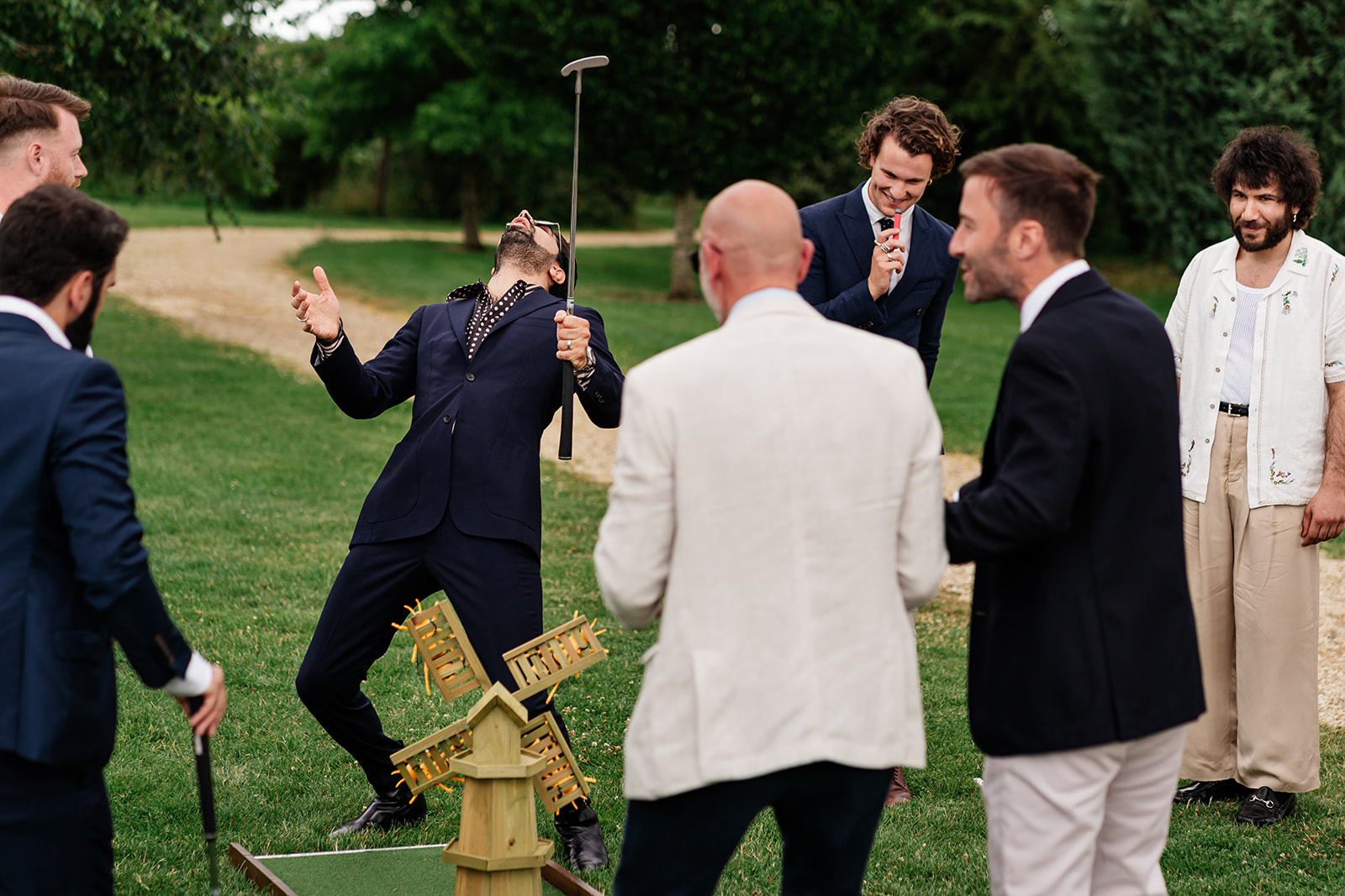 Guests playing crazy golf a wedding 