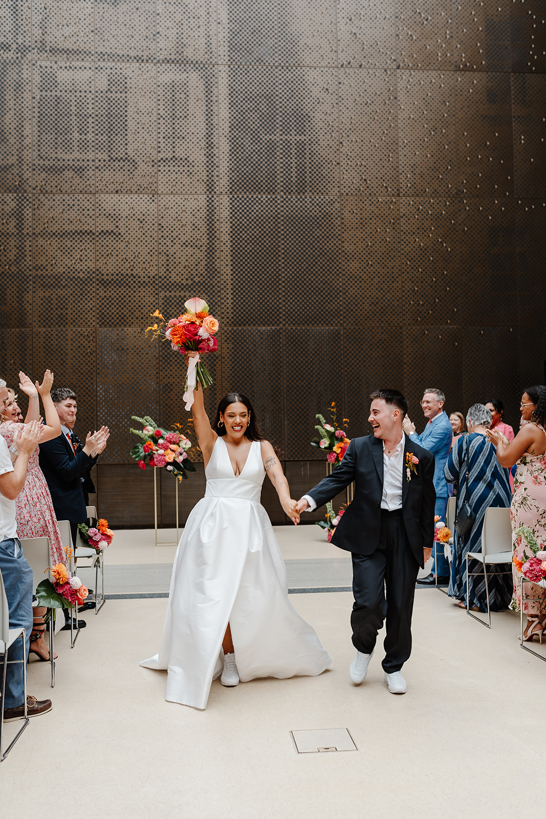 LGBTQ wedding at Hackney Town Hall with colourful, bold florals