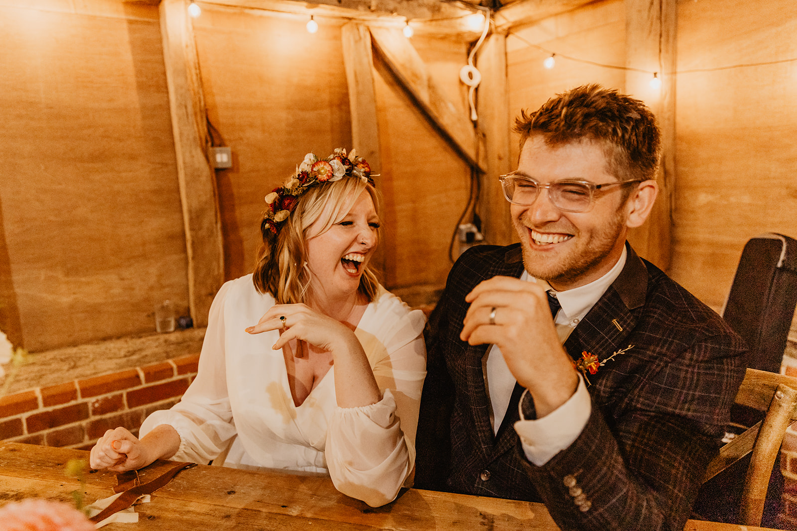 Bride and groom laughing at a wedding at Gilbert White's Hampshire. By OliveJoy Photography.